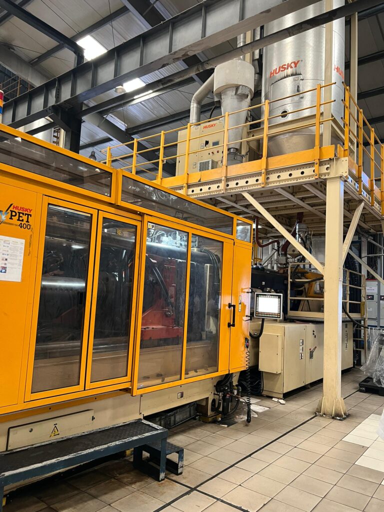 Husky PET 400 injection moulding machine on the production floor of Bakhresa Food Products in Tanzania
